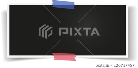 Blank instant photo frame is being attached with two pieces of adhesive tape to a white background, creating a simple yet effective way to display memories or important information 120717457