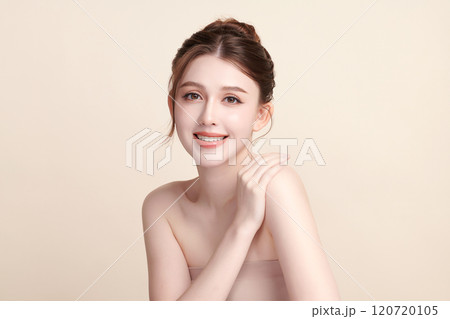 Beautiful young asian woman with clean fresh skin on beige background, Face care, Facial treatment, Cosmetology, beauty and spa, Asian women portrait. Beautiful young asian woman with clean fresh skin on beige background, Face care, Facial treatment, Cosmetology, beauty and spa, Asian women portrait. 120720105