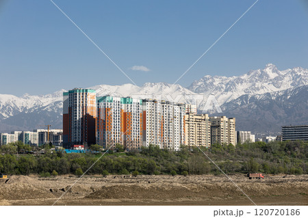 Cityscape, housing complex with best view of mountainous area. Apartment buildings against backdrop of high mountains. Cityscape, housing complex with best view of mountainous area. Apartment buildings against backdrop of high mountains. 120720186