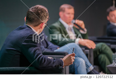 Industry experts discuss strategies in a business conference setting Industry experts discuss strategies in a business conference setting 120722512