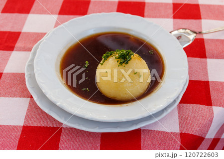 German potato dumpling in sauce on a table German potato dumpling in sauce on a table 120722603