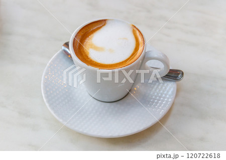 Cup of hot cappuccino coffee on a table Cup of hot cappuccino coffee on a table 120722618