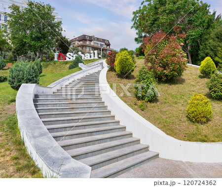 Staircase leading to greenery in Sabail Park, Baku, Azerbaijan under a clear sky 120724362