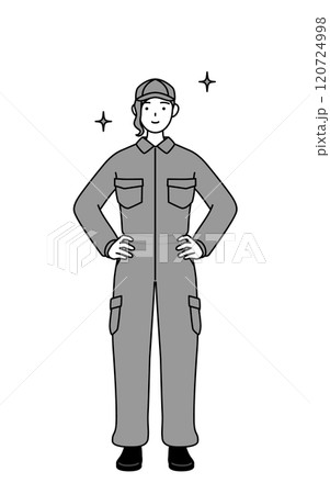 両手を腰に当てたつなぎ姿の女性整備士 120724998