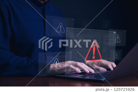 Cybersecurity alert concept. Person using laptop with multiple warning symbols displayed, indicating cyber security alert. importance of digital security and data protection, Cybercrime and virus, 120725926
