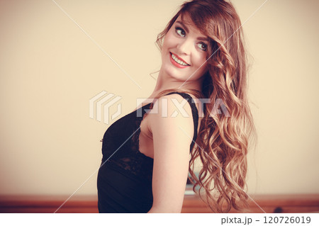 Portrait of happy young woman in lingerie in bed. 120726019