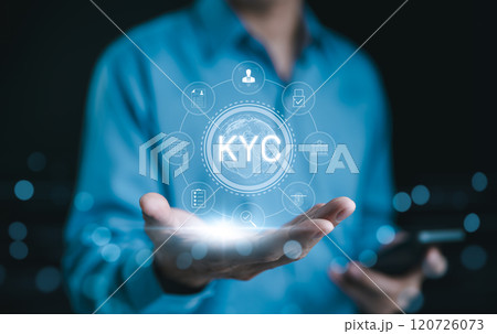 KYC verification concept. Businessman hold glowing digital representation of KYC (Know Your Customer) with compliance and security icons, symbolizing customer identity verification in business. E KYC, KYC verification concept. Businessman hold glowing digital representation of KYC (Know Your Customer) with compliance and security icons, symbolizing customer identity verification in business. E KYC, 120726073