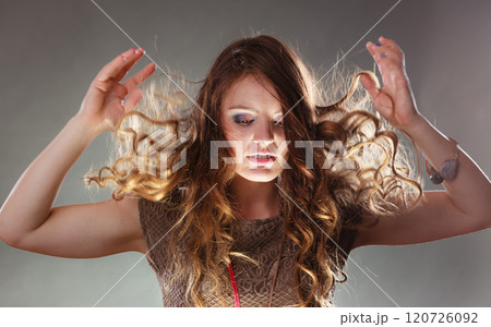 Mysterious enigmatic woman girl with flying hair. Mysterious enigmatic woman girl with flying hair. 120726092