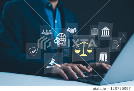 Legal Professional with Justice Icons. Legal professional using laptop with virtual icons symbolizing law, justice, and legal services. business legislation, Notary public, legal advice online, Lawyer 120726097