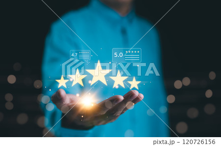 Customer satisfaction with five-star review ratings. Hand holding five star rating icons with digital customer feedback, high customer satisfaction, positive reviews in service or product quality, 120726156