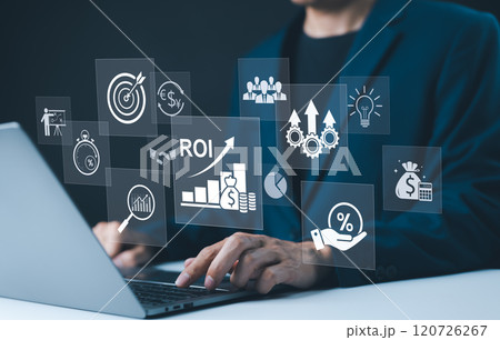 Analyzing ROI and Business Strategy Concepts. Businessman working on a laptop with various digital icons representing ROI, financial strategies, return on investment, and efficiency. marketing plan, 120726267