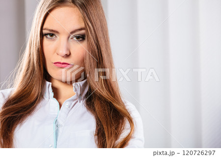 Angry and irritated business woman in office. 120726297