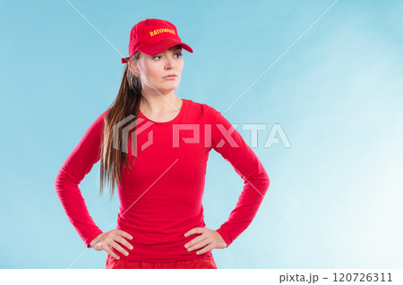 Portrait of lifeguard woman in red cap. Portrait of lifeguard woman in red cap. 120726311