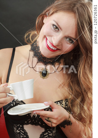 Smiling coquette girl with white cup. 120726361