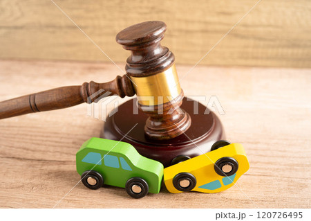 Car accident lawsuit and insurance, Judge hammer with car model. 120726495