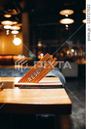 Restaurant reserved table sign in night restaurant 120727022