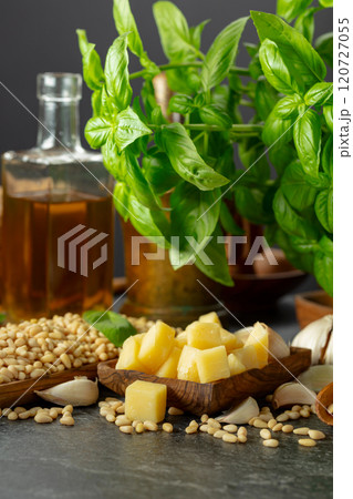 Ingredients for making Pesto sauce on a black stone table. 120727055