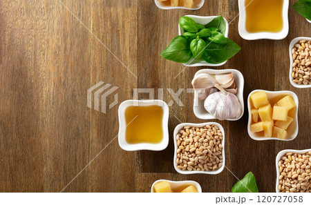 Ingredients for traditional Italian pesto on a wooden background. 120727058