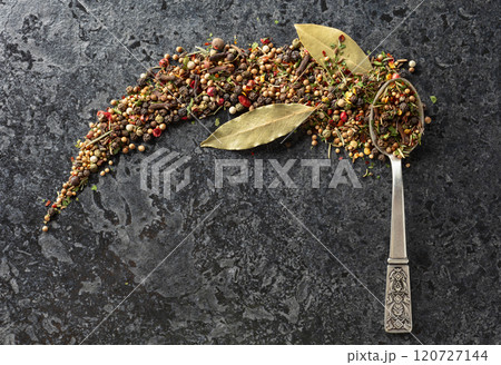 Mix of organic dried spices on a black stone background. 120727144