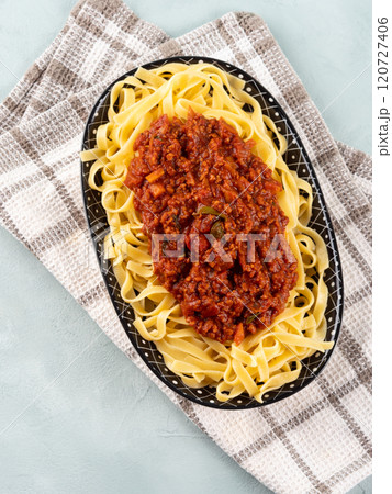 Tagliatelle with vegan tomato bolognese ragu with soya protein granules Tagliatelle with vegan tomato bolognese ragu with soya protein granules 120727406
