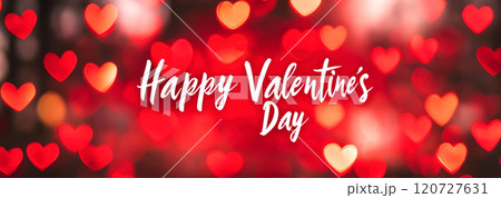 White letters Happy Valentine's Day on a red background with hearts 120727631