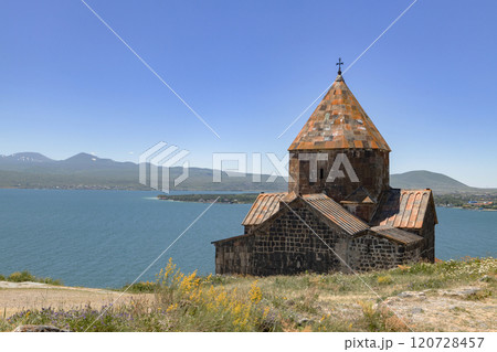 Sevanavank Monastery perched on the shores of Lake Sevan with breathtaking mountainous backdrop in Armenia 120728457