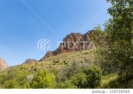 Exploring the stunning beauty of Noravank monastery surrounded by red mountains in Armenia Exploring the stunning beauty of Noravank monastery surrounded by red mountains in Armenia 120728584