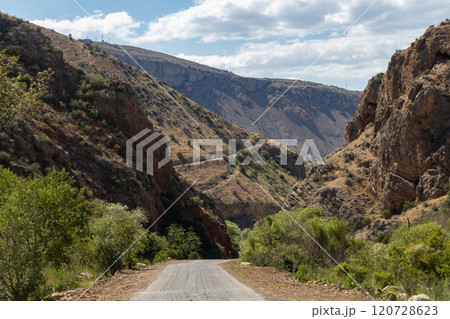 Discover breathtaking Noravank monastery nestled in Armenias stunning red mountains under a bright blue sky 120728623