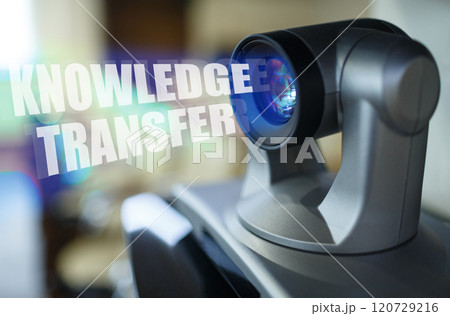 A blue beam glows from the projector inside which is the inscription - KNOWLEDGE TRANSFER A blue beam glows from the projector inside which is the inscription - KNOWLEDGE TRANSFER 120729216