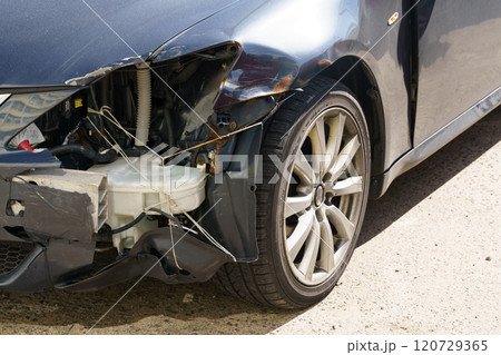 Damaged car parked on the roadside after a minor accident in bright daylight Damaged car parked on the roadside after a minor accident in bright daylight 120729365