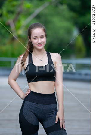 Portrait of fit woman sport wear smile looking to camera. Beautiful happy female strong activewear healthy body. Portrait of fit woman sport wear smile looking to camera. Beautiful happy female strong activewear healthy body. 120729737
