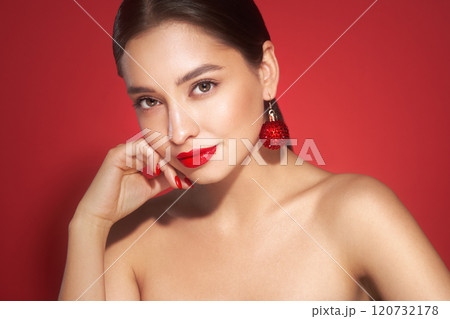 Portrait of beautiful young woman on red background Portrait of beautiful young woman on red background 120732178