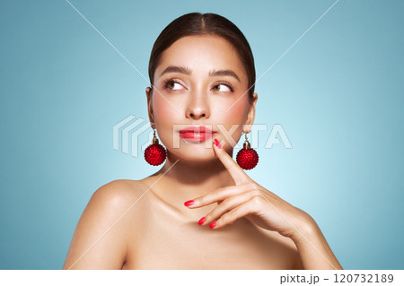 Portrait of beautiful young woman on blue background Portrait of beautiful young woman on blue background 120732189