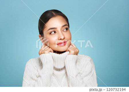 Young beautiful woman in a warm  white sweater 120732194