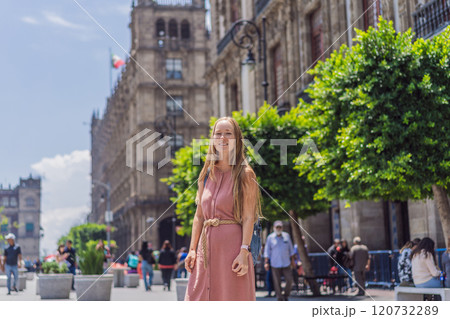 Female tourist in the central square of Mexico City, Zocalo. Cultural exploration, travel, and historic architecture concept 120732289
