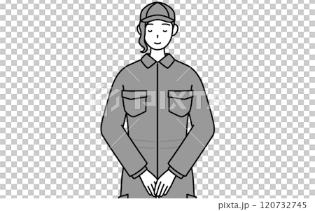 A female mechanic in overalls with her hands folded in front of her 120732745