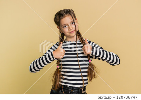 Happy preteen child girl kid looking approvingly at camera showing thumbs up, like positive sign Happy preteen child girl kid looking approvingly at camera showing thumbs up, like positive sign 120736747