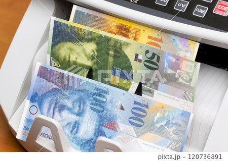 Swiss franc in the counting machine 120736891