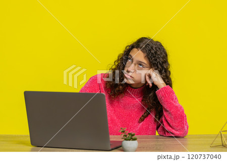 Tired bored stressed Caucasian young teenager girl using laptop feeling annoyed during study or work Tired bored stressed Caucasian young teenager girl using laptop feeling annoyed during study or work 120737040