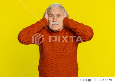 Annoyed irritated senior man covering ears gesturing no avoiding advice ignoring noise loud voices 120737276
