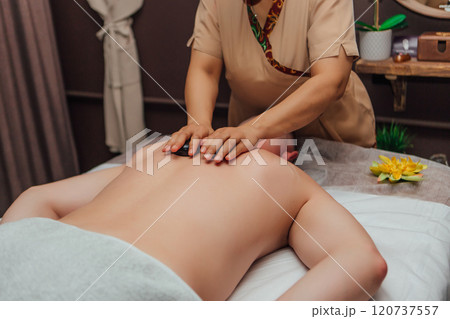 Thai massage with hot volcanic stones Thai massage with hot volcanic stones 120737557