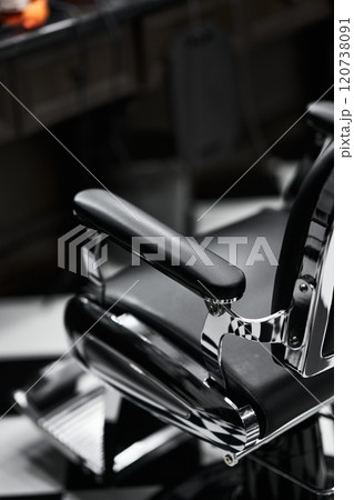 Classic barber chair in a vintage barbershop with black and white decor Classic barber chair in a vintage barbershop with black and white decor 120738091