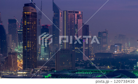 Dubai Downtown night to day timelapse. Aerial view over big futuristic city by night. 120738410