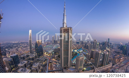 Dubai Downtown day to night timelapse modern towers panoramic view from the top in Dubai, United Arab Emirates. Dubai Downtown day to night timelapse modern towers panoramic view from the top in Dubai, United Arab Emirates. 120738425