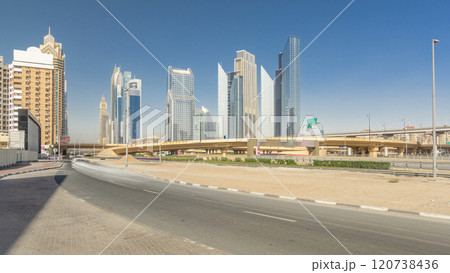 Busy Sheikh Zayed Road timelapse hyperlapse, metro railway and modern skyscrapers around in luxury Dubai city 120738436
