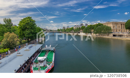 Touristic boat passes below Pont des Arts and stop on boat station on Seine river timelapse hyperlapse in Paris. Touristic boat passes below Pont des Arts and stop on boat station on Seine river timelapse hyperlapse in Paris. 120738506