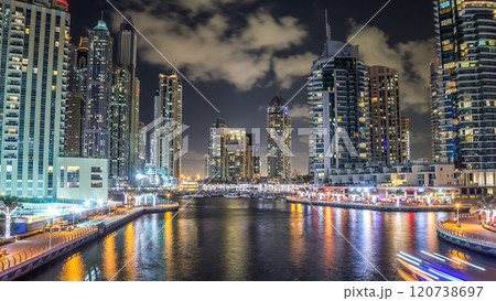 Dubai Marina towers and canal in Dubai night timelapse hyperlapse 120738697