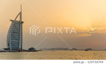 Dubai skyline with Burj Al Arab hotel during sunset timelapse. 120738704