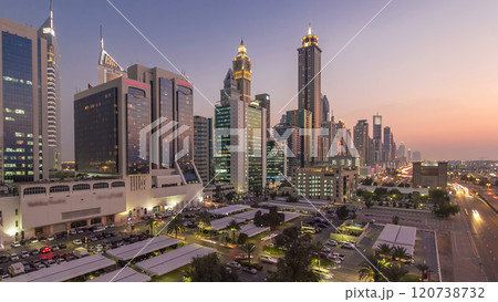 Downtown Dubai towers day to night timelapse. Aerial view of Sheikh Zayed road with skyscrapers after sunset. Downtown Dubai towers day to night timelapse. Aerial view of Sheikh Zayed road with skyscrapers after sunset. 120738732