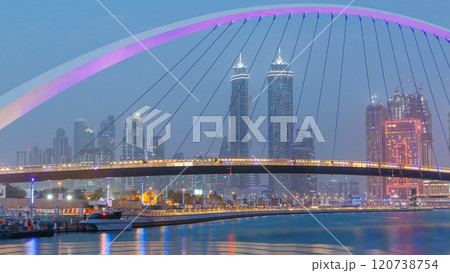Pedestrian Bridge over the Dubai Water Canal day to night timelapse, United Arab Emirates Pedestrian Bridge over the Dubai Water Canal day to night timelapse, United Arab Emirates 120738754